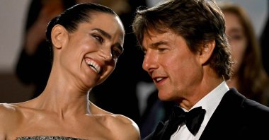 In this file photo taken on May 18, 2022, U.S. actors Jennifer Connelly (L) and Tom Cruise talk as they leave the Festival Palace following the screening of the film &quot;Top Gun: Maverick&quot; during the 75th edition of the Cannes Film Festival in Cannes, southern France. (AFP Photo)