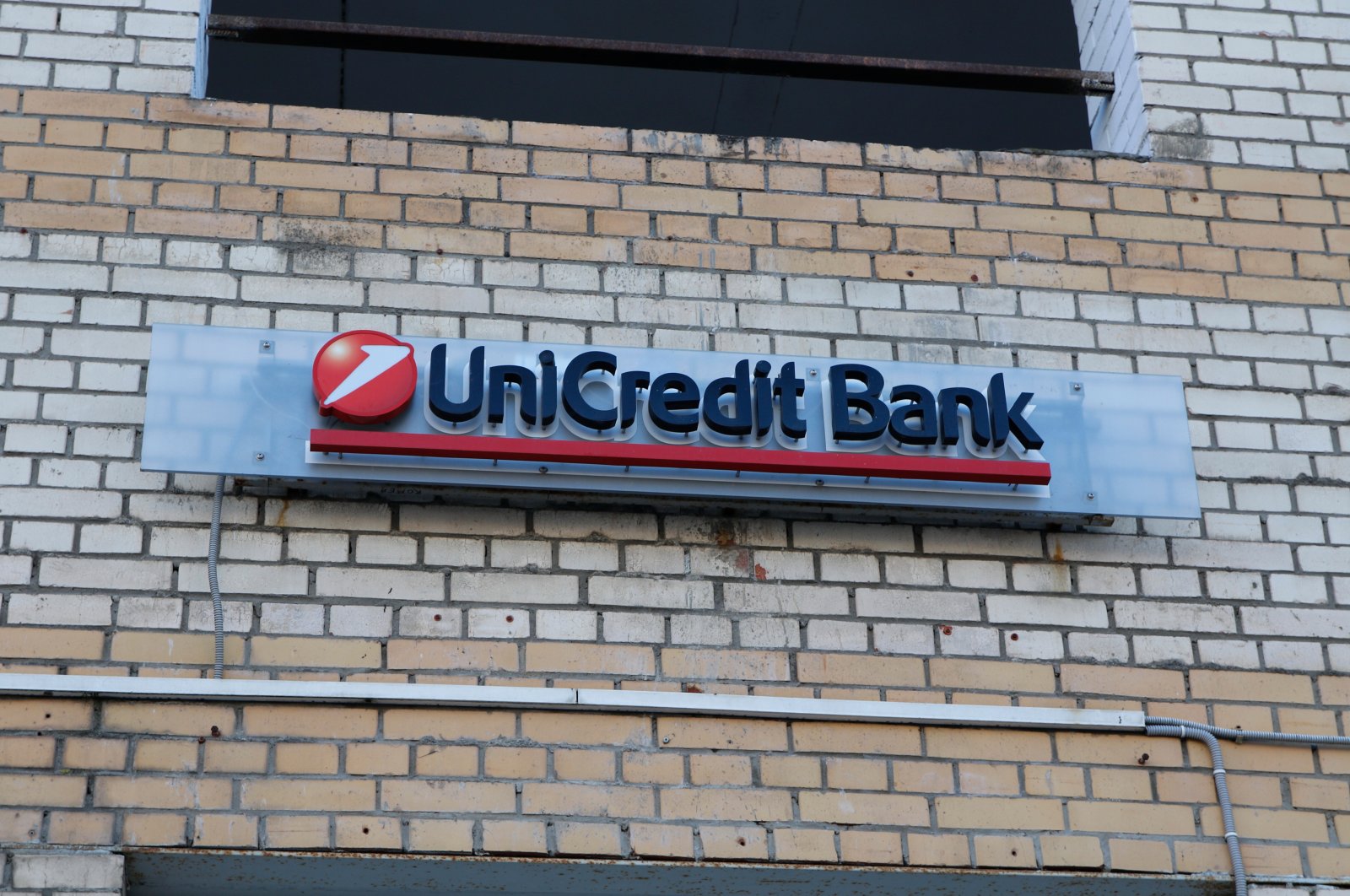 UniCredit Bank logo is seen on a residential building in Saint Petersburg, Russia, Feb. 27, 2022. (Reuters Photo)