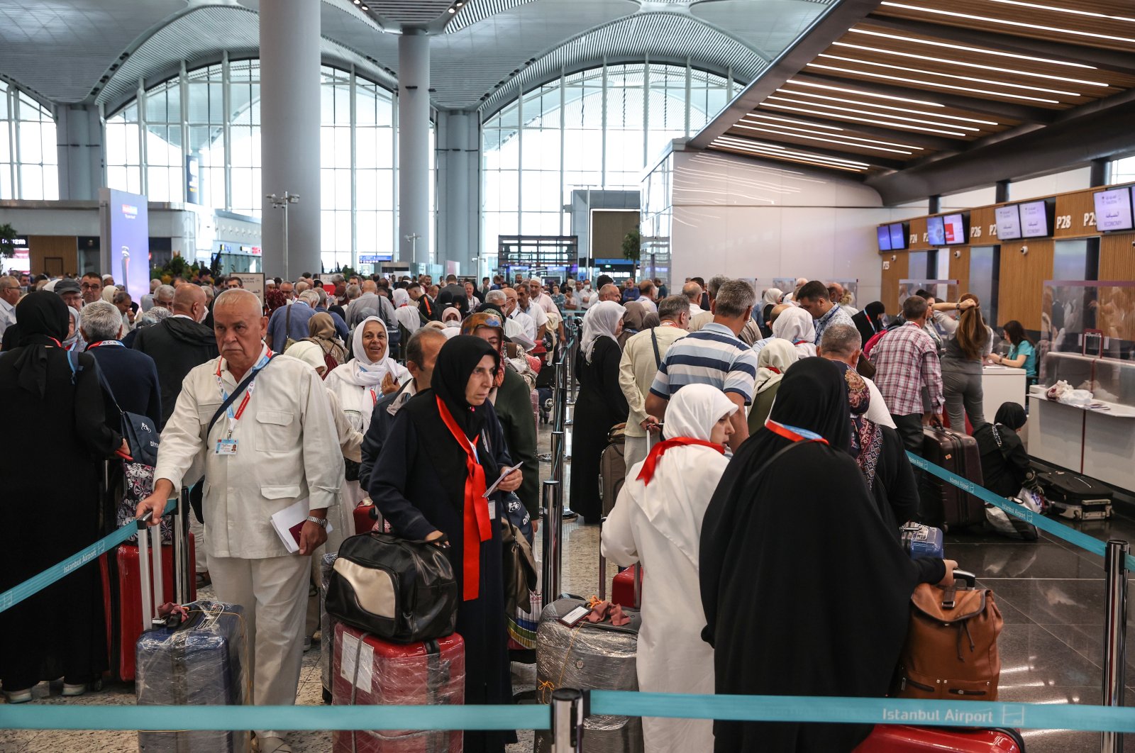 Prospective pilgrims wait to board their flight at the airport, in Istanbul, Turkey, June 7, 2022. (AA PHOTO)