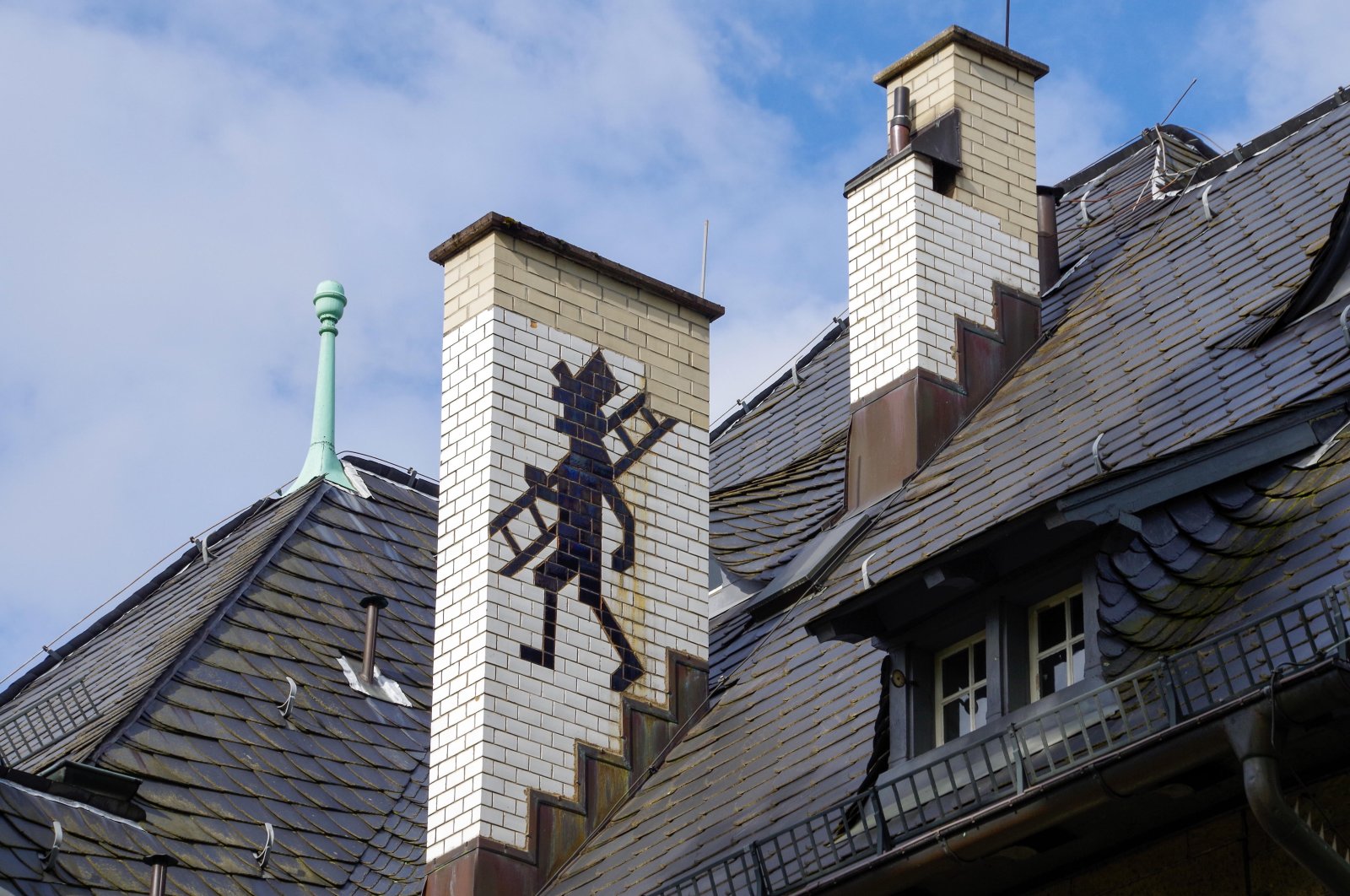 A drawing of a chimney sweep on a rooftop in Baden-Baden, Germany. (Alamy via Reuters)