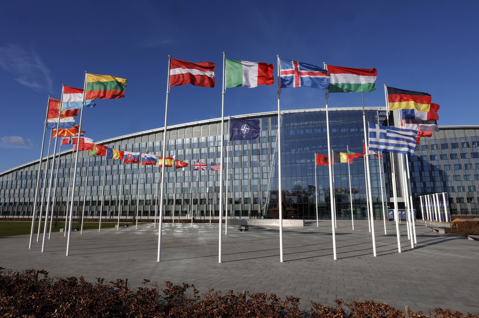 FILE - Flags flutter in the wind outside NATO headquarters in Brussels, Feb. 7, 2022. Finland and Sweden have signaled their intention to join NATO over Russia’s war in Ukraine and things will move fast once they formally apply for membership in the world’s biggest security alliance. Russian President Vladimir Putin has already made clear that there would be consequences if the two Nordic countries join.  (AP Photo/Olivier Matthys, File)