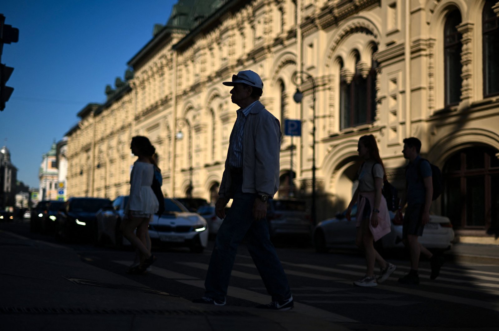 People cross a street in downtown Moscow, Russia, June 7, 2022. (AFP Photo)