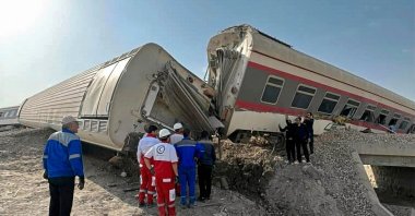 Rescuers at the scene of a train derailment near the central Iranian city of Tabas on the line between Mashhad and Yazd, ıran, June 8, 2022. (Iranian Red Crescent via AFP)