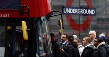 Commuters attempt to board a bus outside Victoria train station during a 24-hour strike by nearly 4,000 London Underground station staff, in London, U.K., June 6, 2022. (AFP Photo)