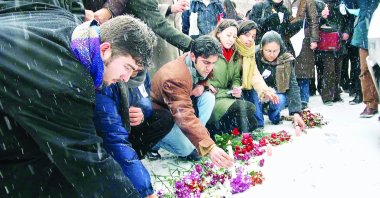People leave flowers on the spot where Hablemitoğlu was killed, in the capital Ankara, Turkey, Dec. 19, 2002. (AA PHOTO) 