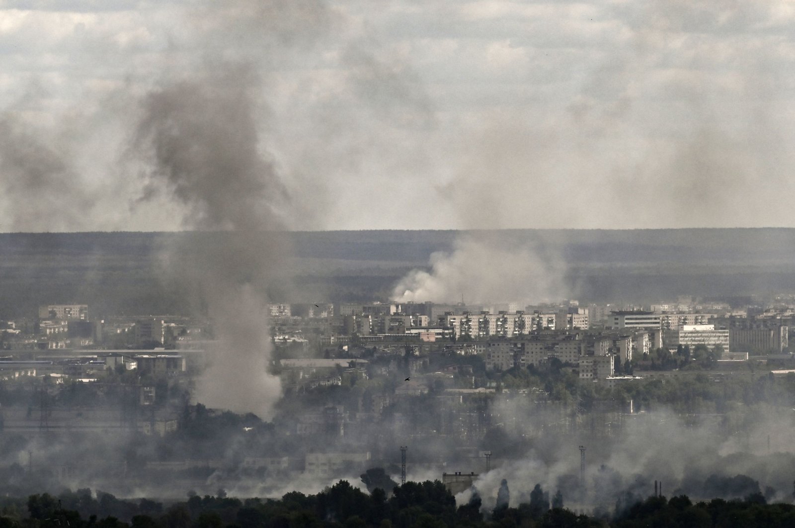 Smoke and dirt rise from shelling in the city of Severodonetsk during fight between Ukrainian and Russian troops in the eastern Donbass region, Ukraine, June 7, 2022. (AFP Photo)