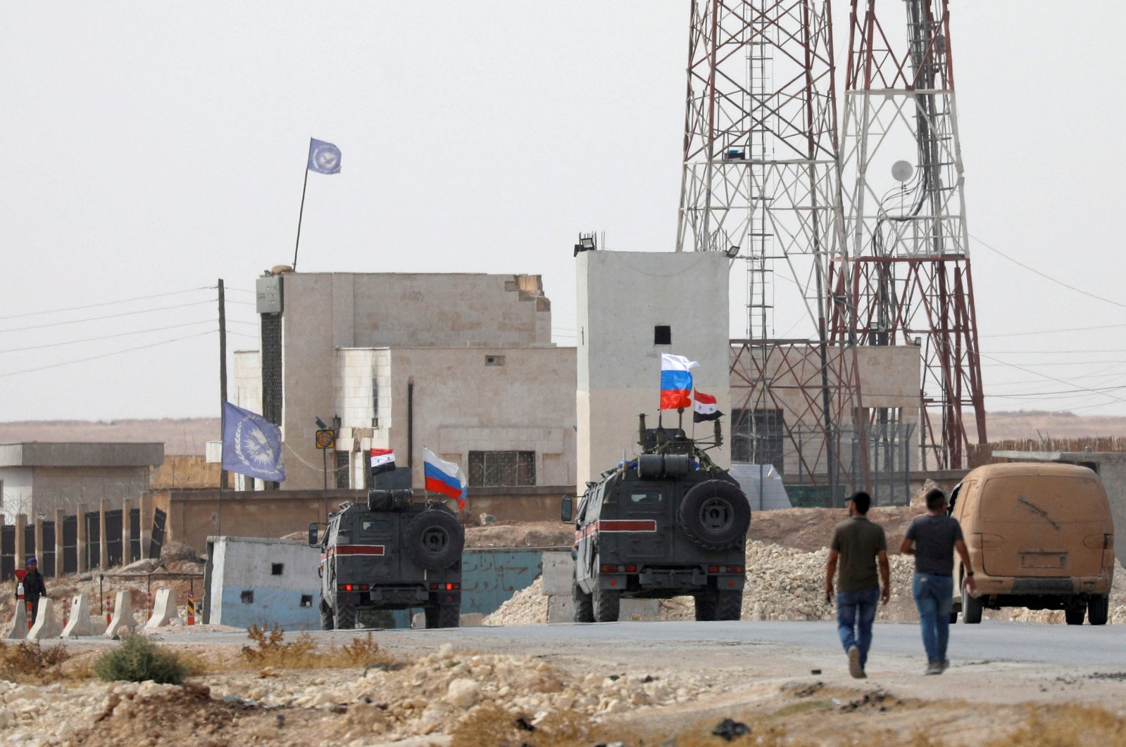 Russian national flags flutter on military vehicles near Manbij, Syria, October 15, 2019. REUTERS/Omar Sanadiki/File Photo