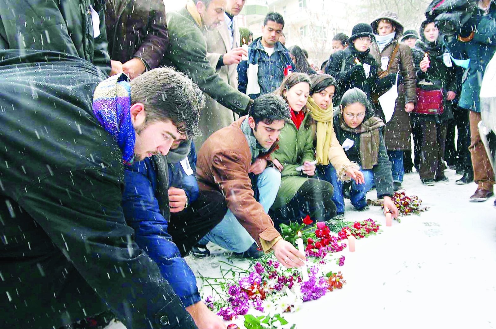 People leave flowers on the spot where Hablemitoğlu was killed, in the capital Ankara, Turkey, Dec. 19, 2002. (AA PHOTO) 