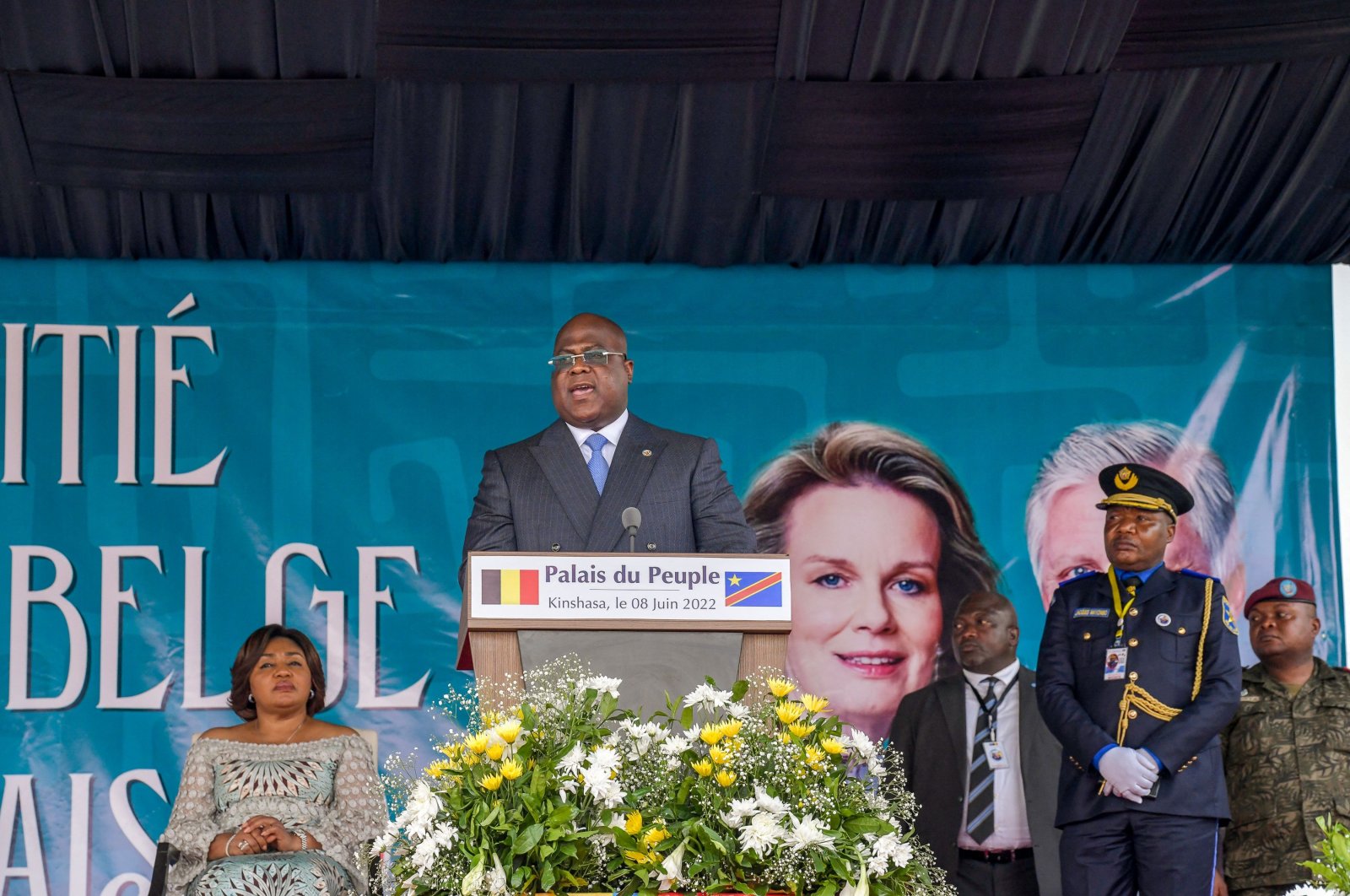 Democratic republic of Congo President Felix Tshisekedi addresses the crowd as his wife Denise Nyakeru Tshisekedi (L) looks on during a ceremony at the National Assembly in Kinshasa, June 8, 2022 (AFP Photo)
