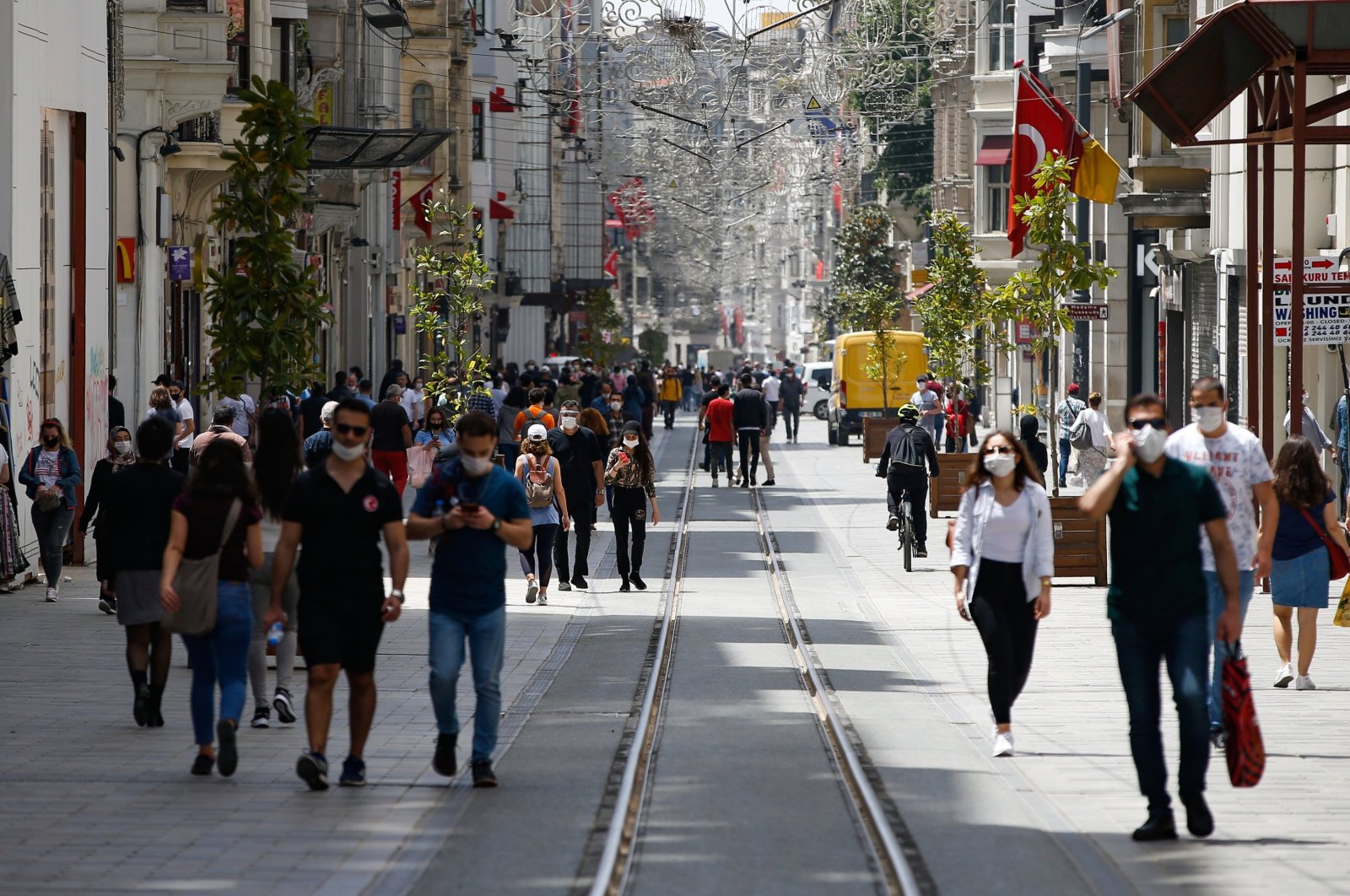 People walk on Istiklal Avenue, one of the main shopping streets in Istanbul, Turkey, during the coronavirus outbreak, May 15, 2020. (AP Photo)