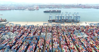 An aerial view shows containers and cargo vessels at the Qingdao port in Shandong province, China, May 9, 2022. (Reuters Photo)