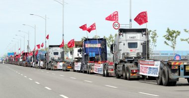 Cargo trucks occupy a road at a port in Incheon, South Korea, June 7, 2022. (Yonhap Photo via EPA)