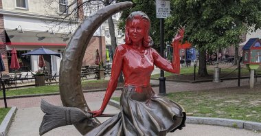 This image provided by Daniel Fury shows the "Bewitched" statue partially covered with red paint, in Salem, Massachusetts, U.S., June 6, 2022. (AP Photo)