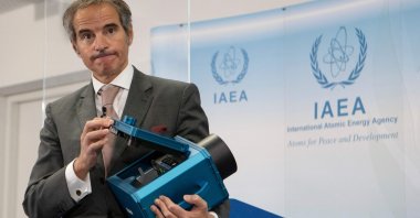 Director-General of the International Atomic Energy Agency (IAEA) Rafael Mariano Grossi presents a surveillance camera at the agency's headquarters in Vienna, Austria, Dec. 17, 2021. (AFP File Photo)