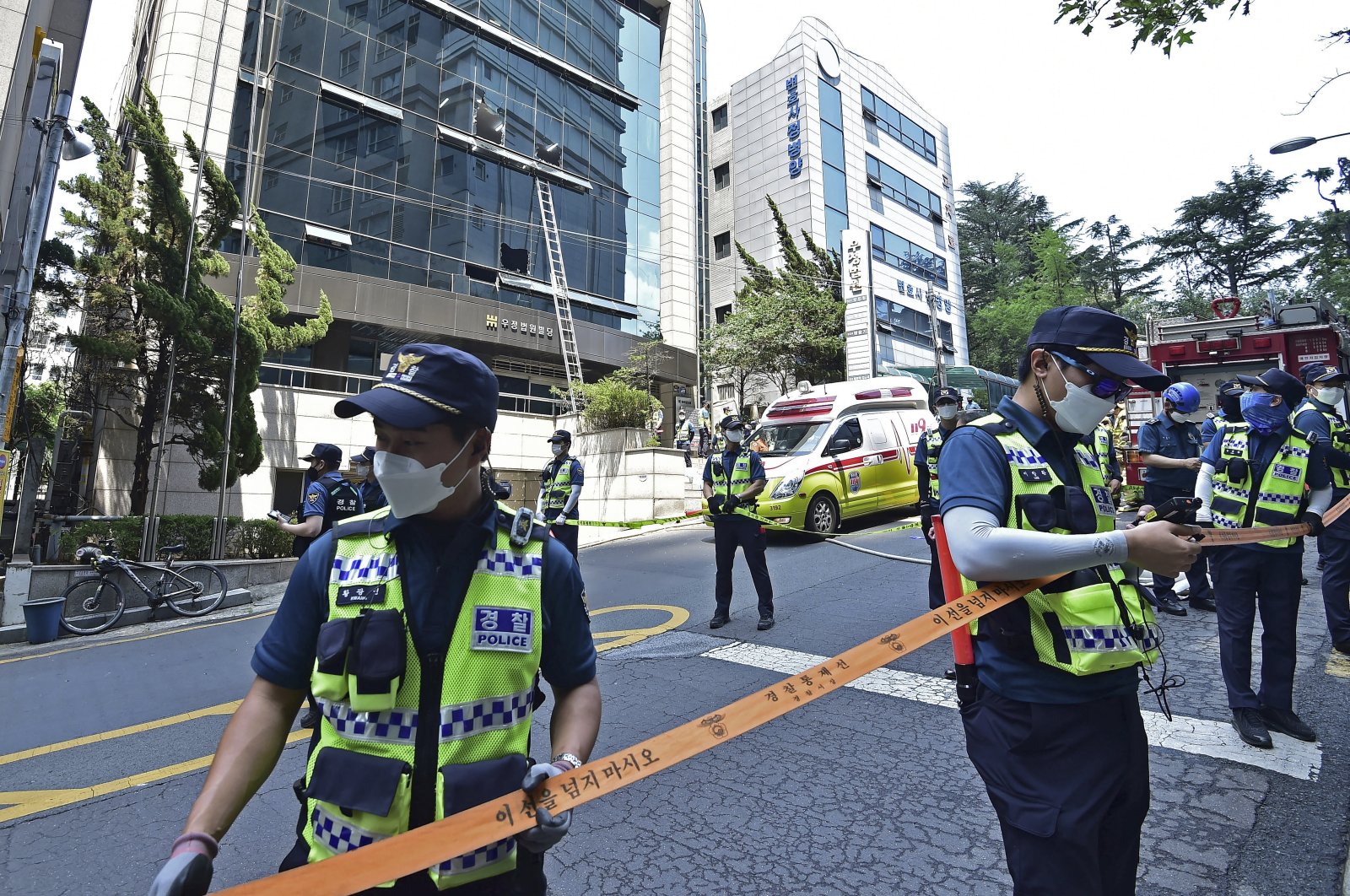 Police officers control the scene of a fire in Daegu, South Korea, June 9, 2022. (Newsis via AP)