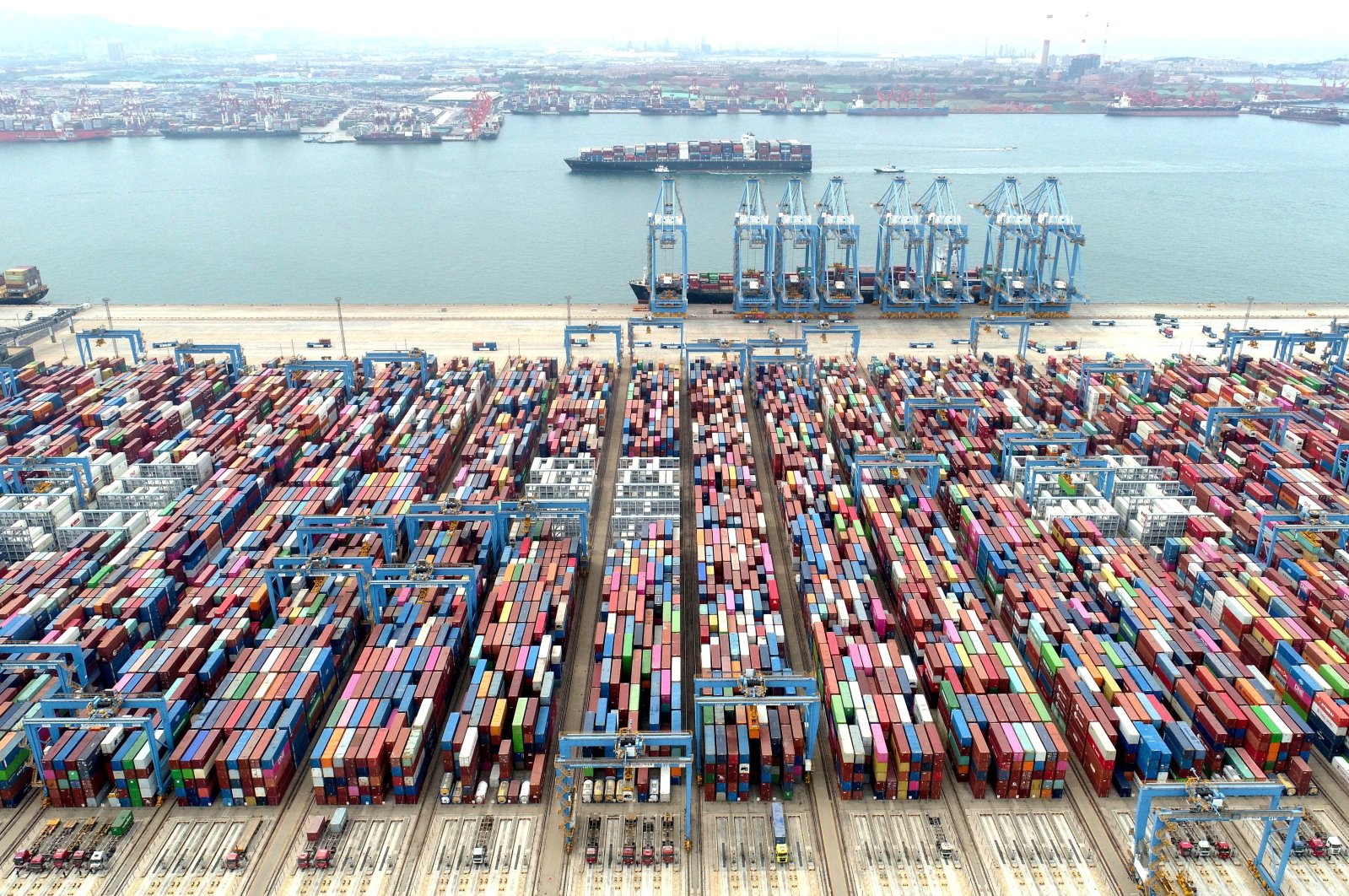 An aerial view shows containers and cargo vessels at the Qingdao port in Shandong province, China, May 9, 2022. (Reuters Photo)