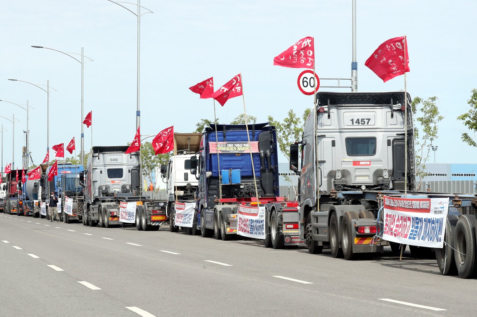 Cargo trucks occupy a road at a port in Incheon, South Korea, June 7, 2022. (Yonhap Photo via EPA)