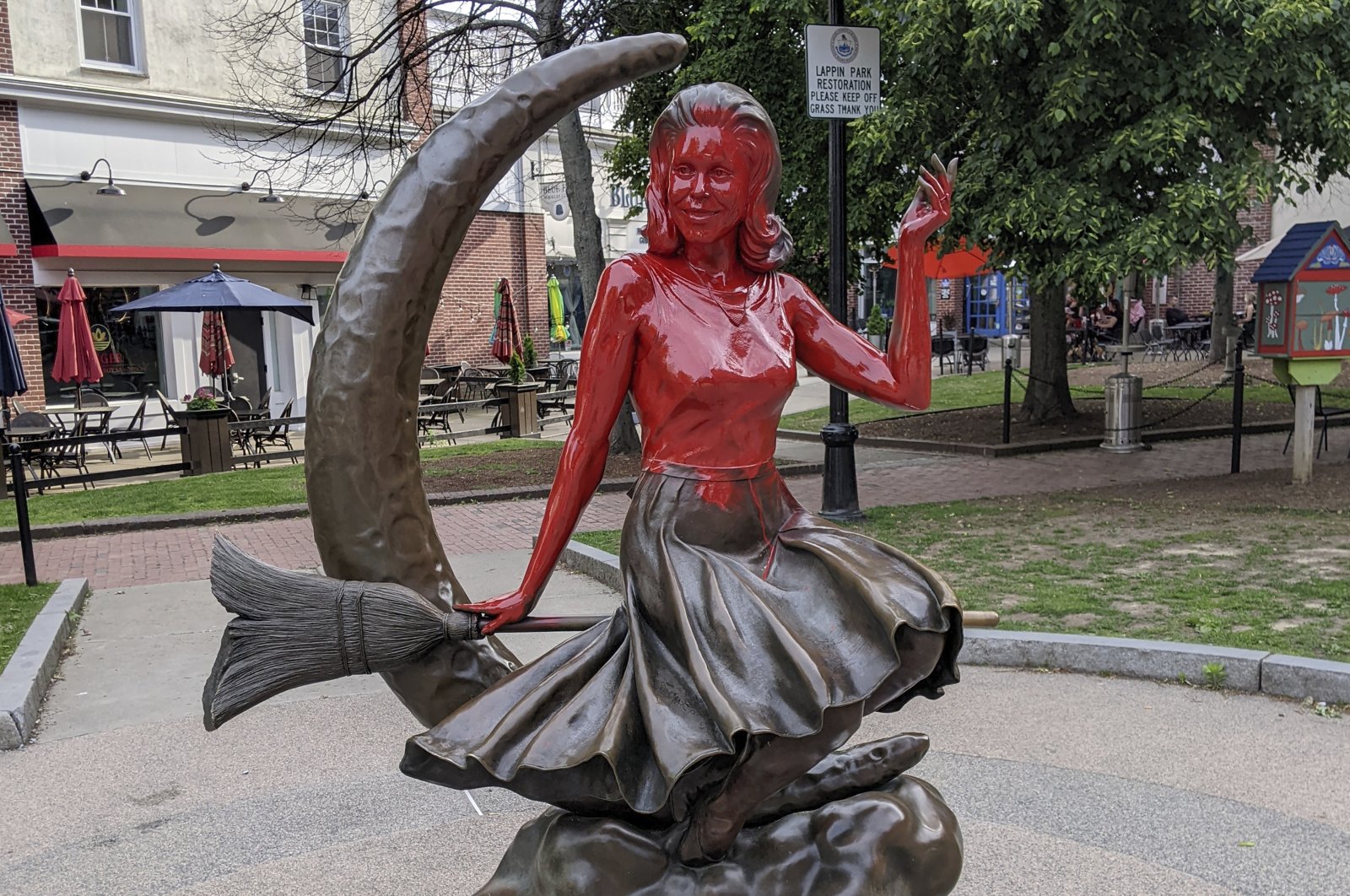 This image provided by Daniel Fury shows the "Bewitched" statue partially covered with red paint, in Salem, Massachusetts, U.S., June 6, 2022. (AP Photo)