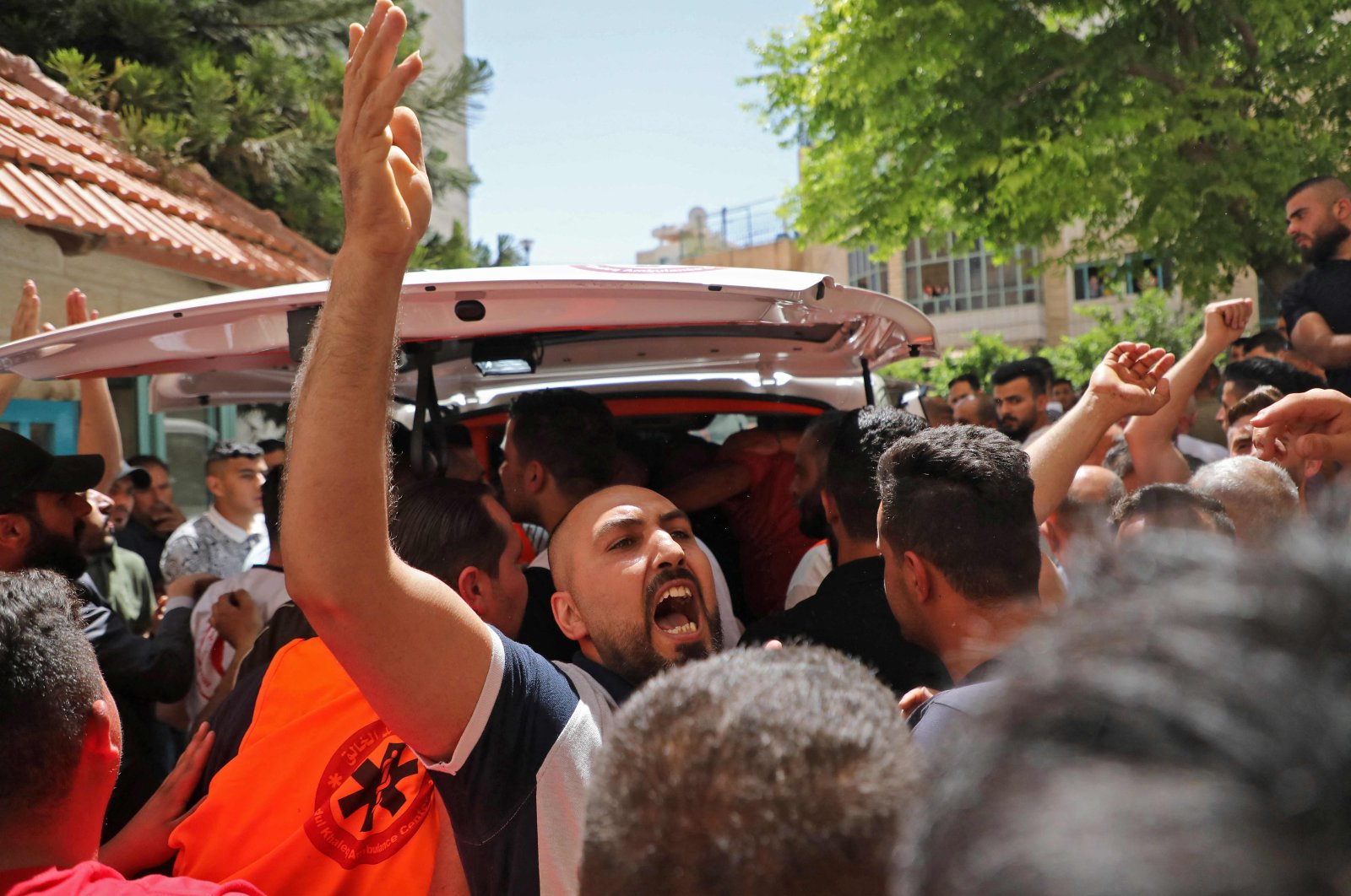 Mourners react as they carry the body of 27-year-old Palestinian Mahmud Fayez Abu Ayhour from the morgue of the Al-Mizan Hospital in Hebron, the West Bank, Palestine, June 9, 2022.  (AFP Photo)