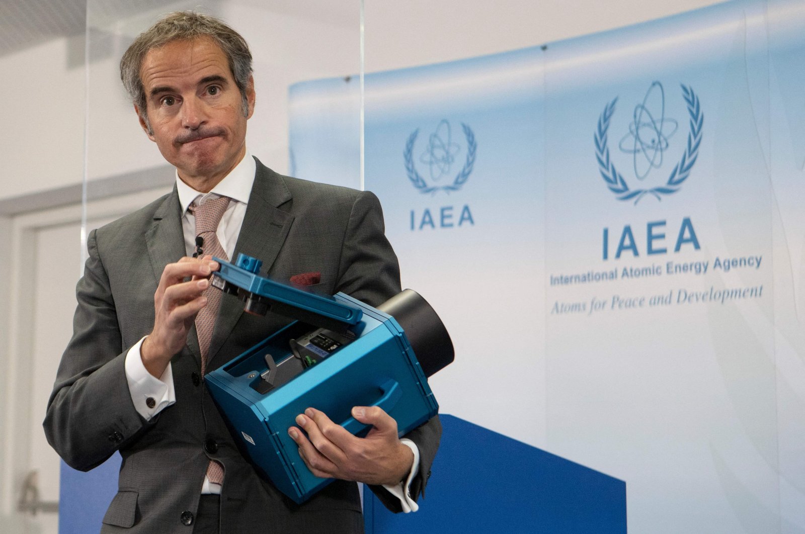 Director-General of the International Atomic Energy Agency (IAEA) Rafael Mariano Grossi presents a surveillance camera at the agency&#039;s headquarters in Vienna, Austria, Dec. 17, 2021. (AFP File Photo)