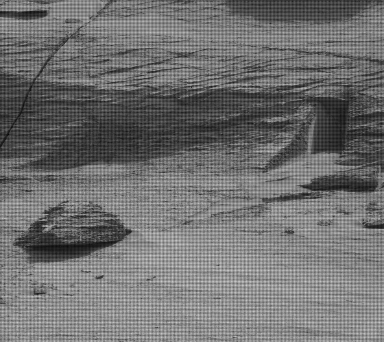 This image made available by NASA was taken by the Mast Camera onboard NASA's Mars rover Curiosity on Sol 3466, NASA’s Mars rover has captured images of a doorway cut into a mountainside of the red planet, suggesting the presence of extraterrestrial life, May 20, 2022. (AP Photo)