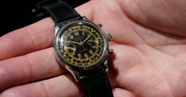 The Rolex Stainless steel chronograph wristwatch, ref. 3525, “Monoblocco” worn by RAF Lt. Gerald Imeson is displayed at Christie’s, New York, U.S, June 1, 2022. (AFP Photo)