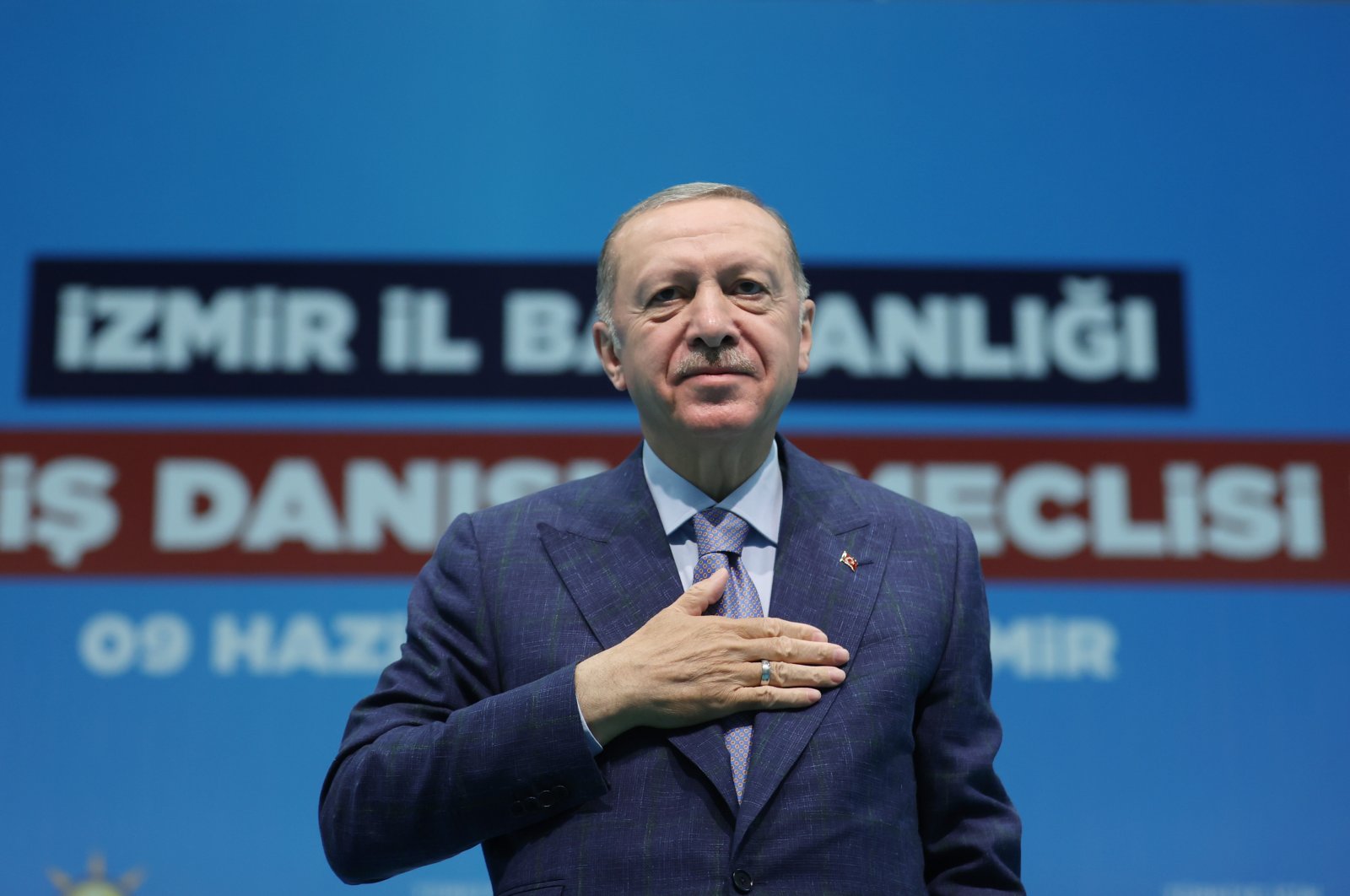 President Recep Tayyip Erdoğan salutes his ruling Justice and Development Party (AK Party) followers during a meeting in western Izmir province, Turkey, June 9, 2022. (DHA Photo)