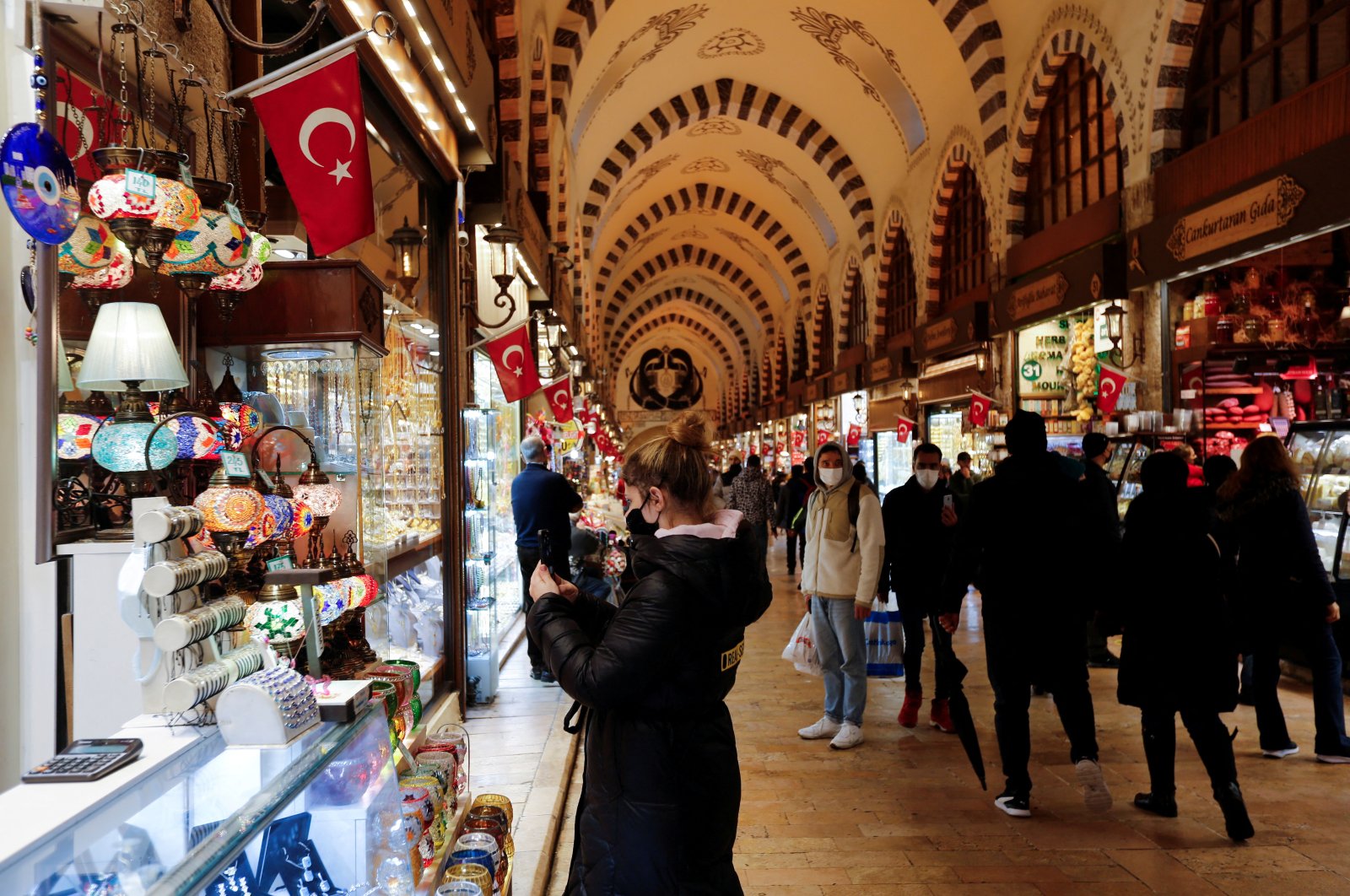 People shop at the Spice Market, also known as the Egyptian Bazaar, in Istanbul, Turkey, Dec. 16, 2021. (Reuters Photo)