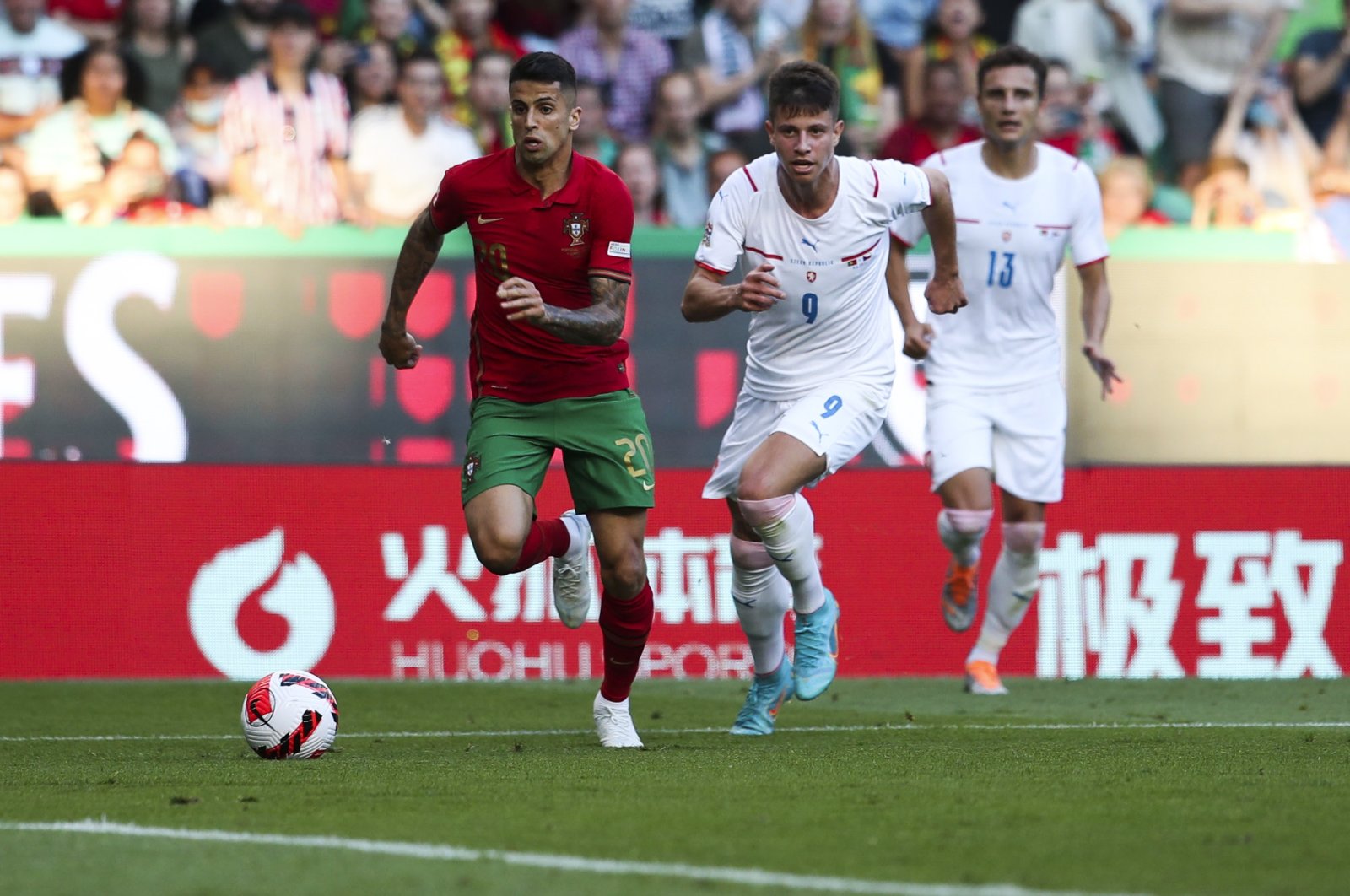 Portugal&#039;s Joao Cancelo (L) in action with Czech Republic&#039;s Adam Hlozek during a UEFA Nations League match, Lisbon, Portugal, June 9, 2022. (EPA Photo)