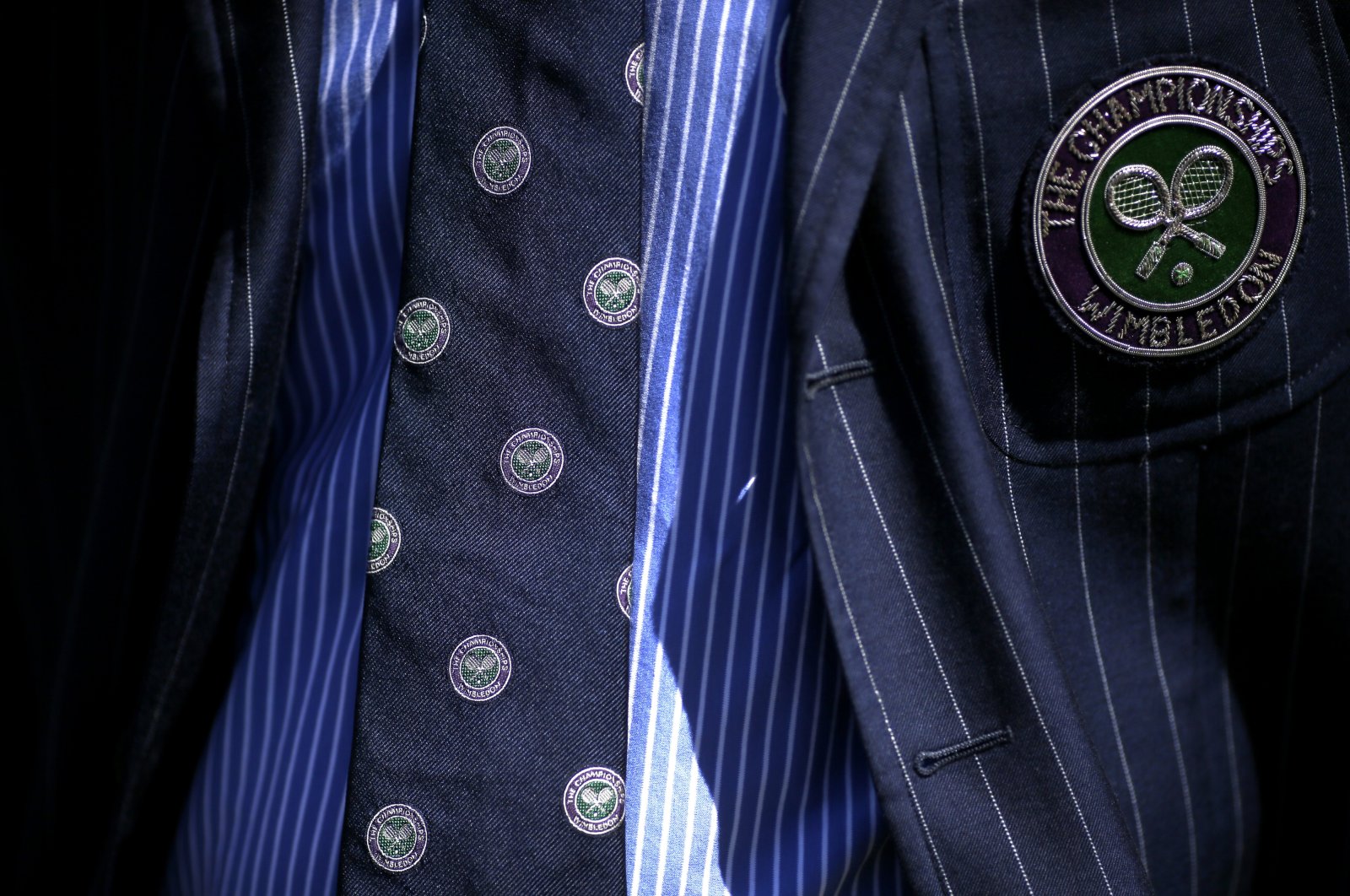 The umpire&#039;s tie and jacket display the logo of the Wimbledon Championships, London, England, July 2, 2018. (AP Photo)