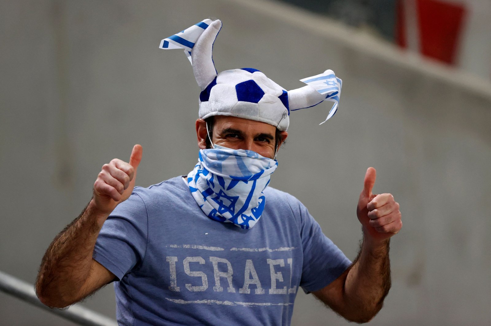 An Israeli fan gestures during the 2022 FIFA World Cup qualifier against Denmark, Tel Aviv, Israel, March 25, 2021. (AFP Photo)