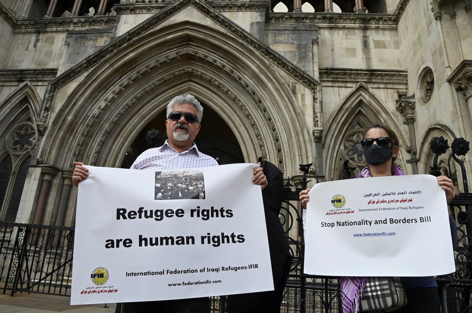 Demonstrators protest outside the Royal Courts of Justice whilst a legal case is heard over halting a planned deportation of asylum seekers from Britain to Rwanda, London, Britain, June 10, 2022. (Reuters Photo)
