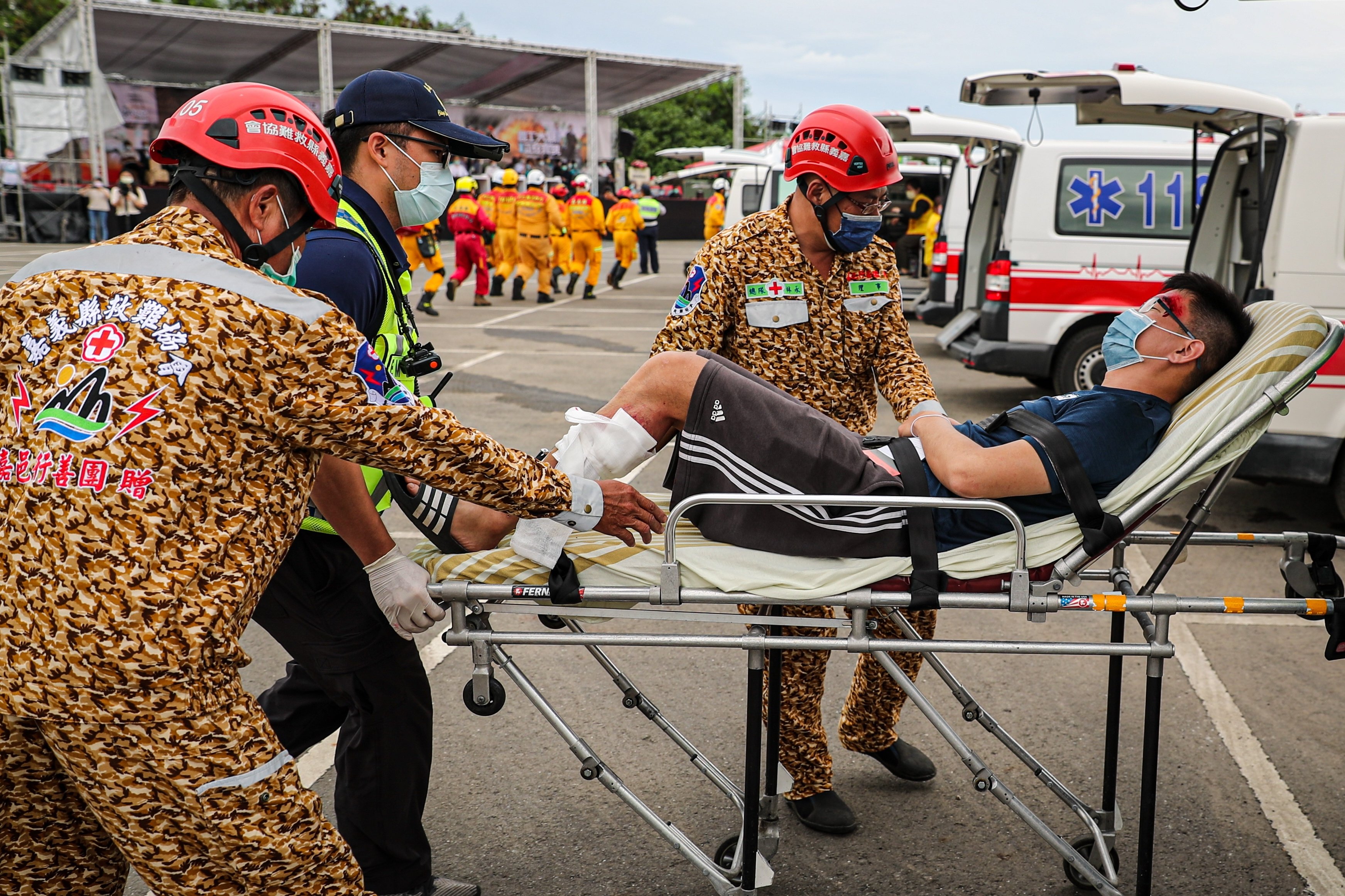 A mock victim is carried to an ambulance during the Min-An Drill or Emergency response drill to prepare civil servants how to react in the event of an attack, in Chiayi, Southern Taiwan, June 9, 2022. (EPA Photo)