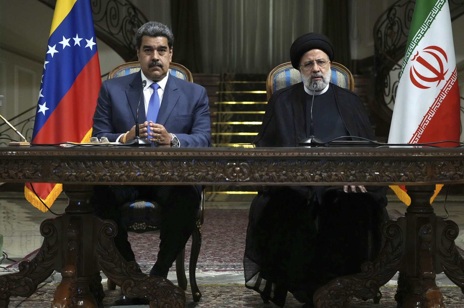 Iranian President Ebrahim Raisi (R) speaks in a joint news briefing with his Venezuelan counterpart Nicolas Maduro at the Saadabad Palace in Tehran, Iran, June 11, 2022. (AP Photo)