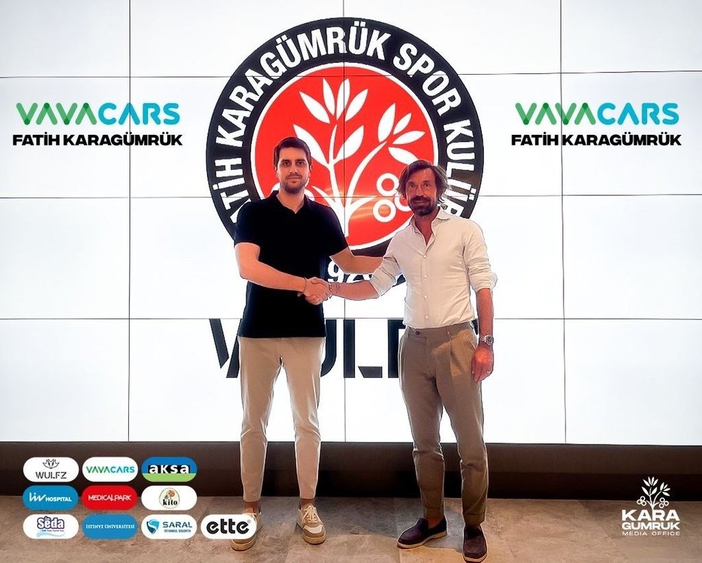 Italian football great Andrea Pirlo (R) shakes hands with a Fatih Karagümrük official after his appointment as the new coach of the club, Istanbul, Turkey, June 12, 2022. (IHA Photo)
