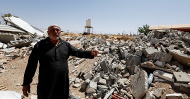 Palestinian Mahmoud Najajreh points at his demolished house, in Masafer Yatta, South of Hebron, in the Israeli-occupied West Bank, Palestine, May 31, 2022. (Reuters Photo)