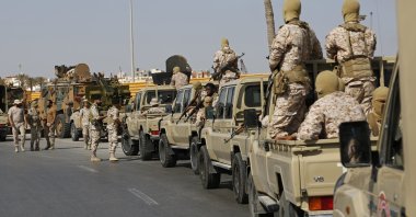 FILE- Forces loyal to Abdul Hamid Dbeibah, one of Libya's two rival prime ministers, secure the streets of the capital, Tripoli, on May, 17, 2022. The United Nations mission to Libya expressed concern Saturday, June 11, 2022,  over clashes in Tripoli, after a night of heavy fire between militias in the capital. The latest fighting comes as Libya is once again divided between competing governments - one of which is based in Tripoli - despite more than a year of tentative steps towards unification.
(AP Photo/Yousef Murad, File)