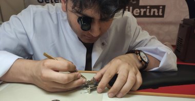 A high school student working on a wristwatch, Bursa, Turkey, June 12, 2022. (IHA Photo)