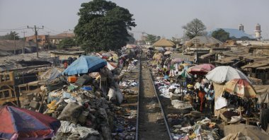The Lagos to Kano rail track passes through a central market in Kaduna, Nigeria, March 9, 2013. (AP Photo)