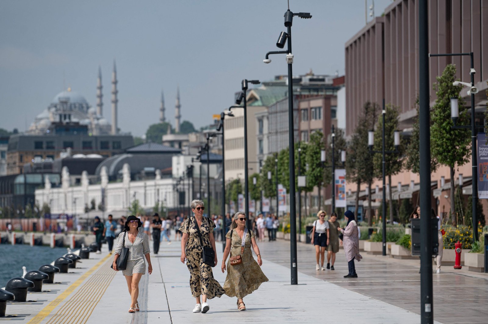 Visitors stroll along Galataport in Istanbul, Turkey, June 3, 2022. (AFP Photo)