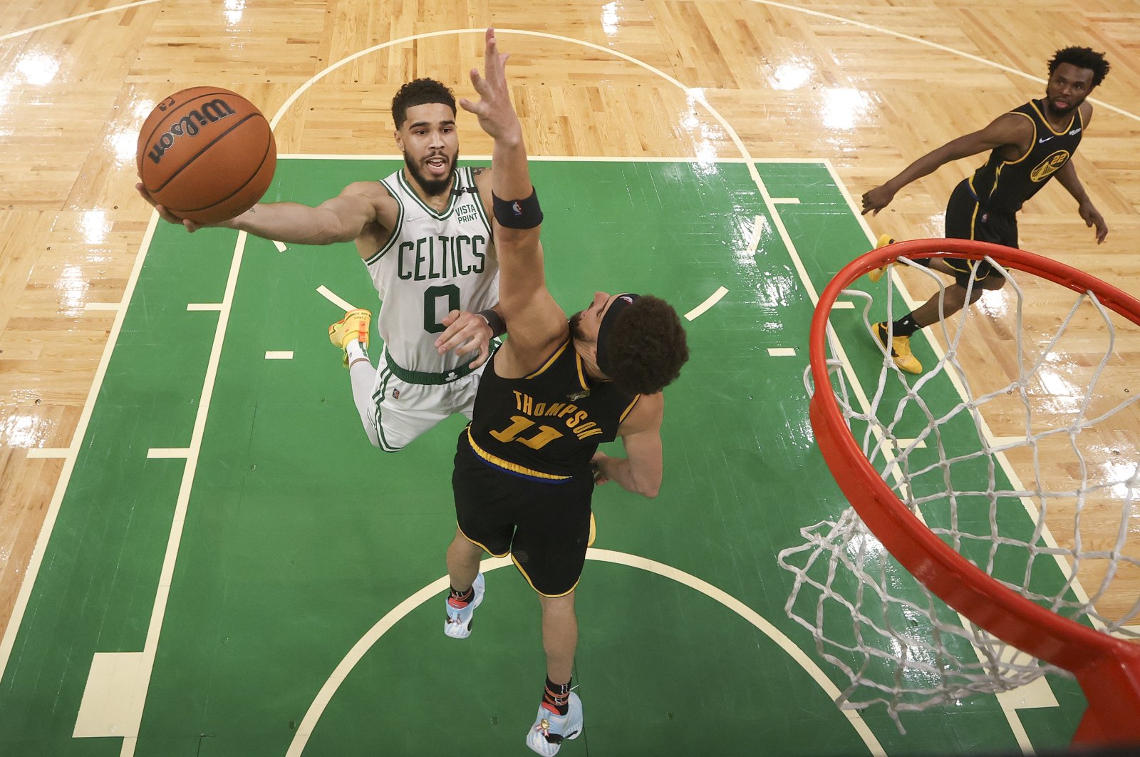 Boston Celtics forward Jayson Tatum (L) goes up for a shot against Golden State Warriors guard Klay Thompson during Game 4 of NBA Finals, Friday, June 10, 2022, in Boston. (AP Photo)