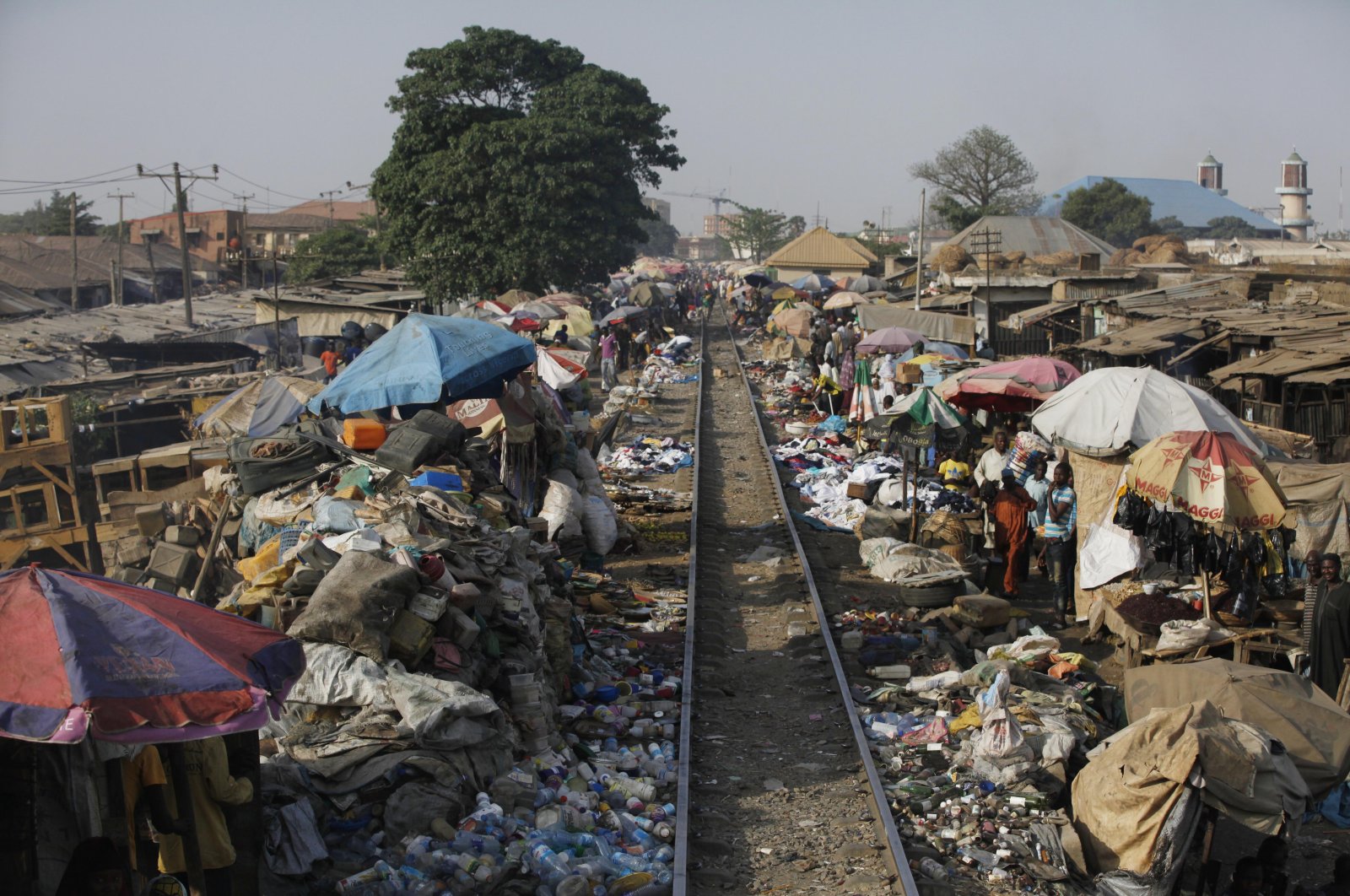 The Lagos to Kano rail track passes through a central market in Kaduna, Nigeria, March 9, 2013. (AP Photo)