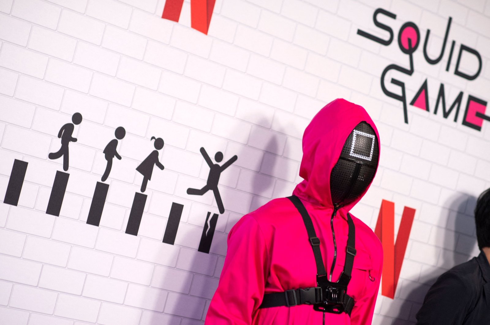 A pink soldier guard is part of the ambiance at Netflix&#039;s &quot;Squid Game&quot; Los Angeles FYSEE Special Event at Netflix FYSEE at Raleigh Studios  in Los Angeles, California, U.S., June 12, 2022. (AFP Photo)