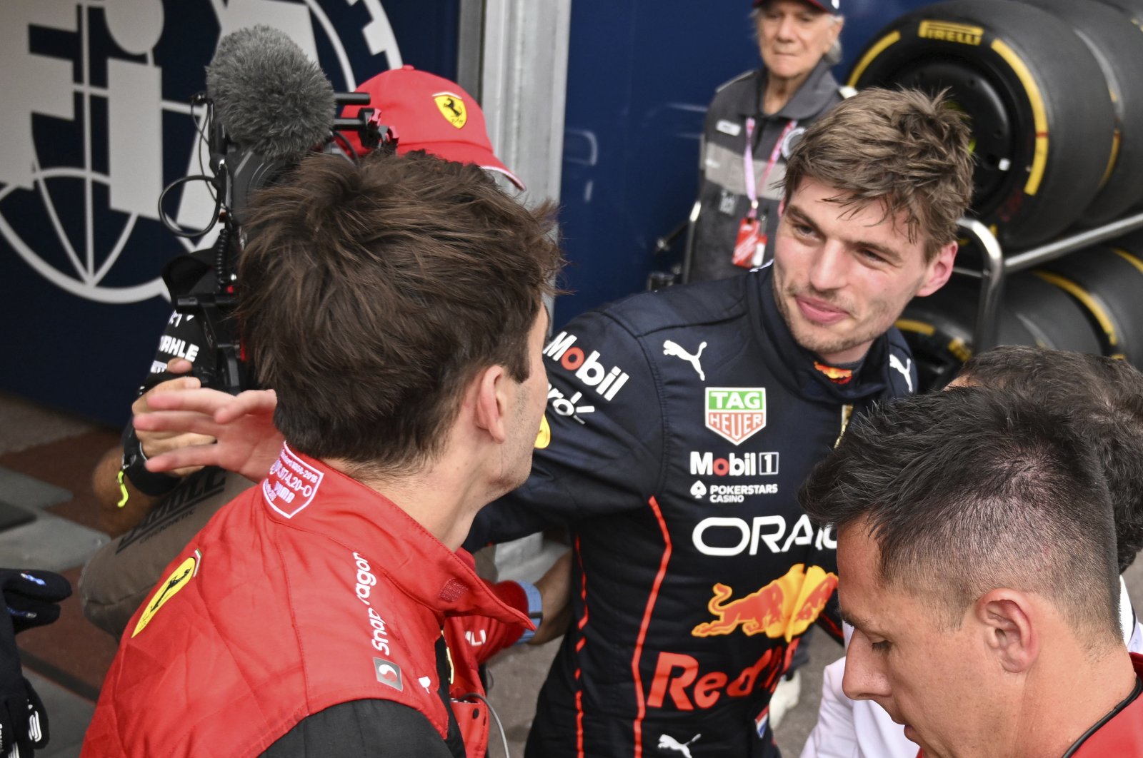 Red Bull driver Max Verstappen (R) congratulates Ferrari driver Charles Leclerc after taking pole position at the Monaco GP, Monte Carlo, Monaco, May 28, 2022. (AP Photo)