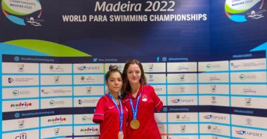 Turkish Para swimmers Sümeyye Boyacı (R) and Sevilay Öztürk pose after winning gold and silver, respectively, in a World Para Swimming Championships event, Madeira, Portugal, June 13, 2022. (AA Photo)