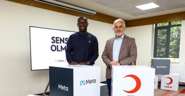Turkish Red Crescent&#039;s (Kızılay) Dr. Kerem Kınık (R) and Meta executive Kojo Boakye pose at the launch of the tool, Istanbul, June 14, 2022. (Courtesy of the Turkish Red Crescent)