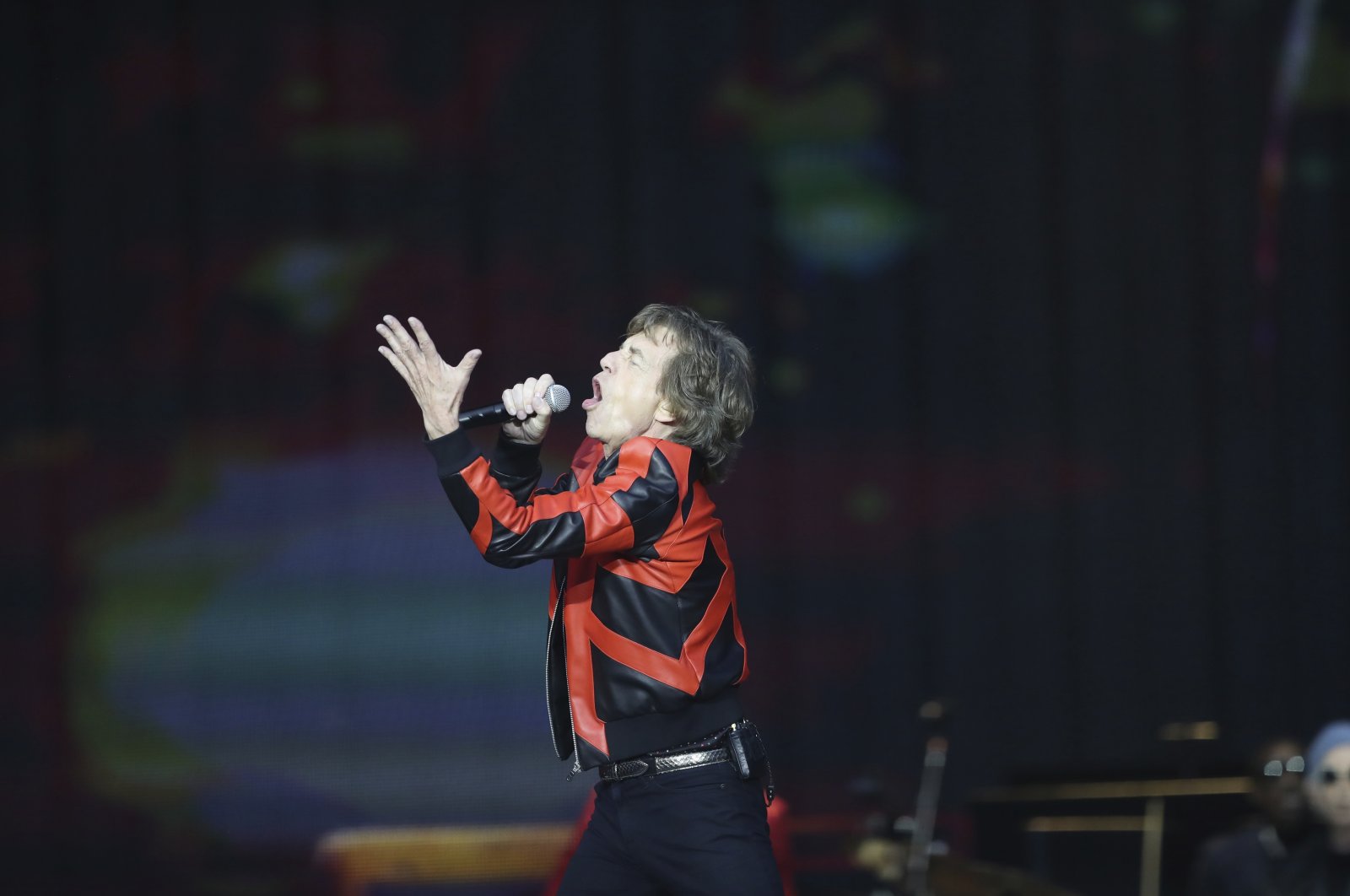 Mick Jagger of the Rolling Stones gestures as they play on stage at the Anfield stadium in Liverpool, England, during a concert as part of their &quot;Sixty&quot; European tour, June 9, 2022. (AP Photo)