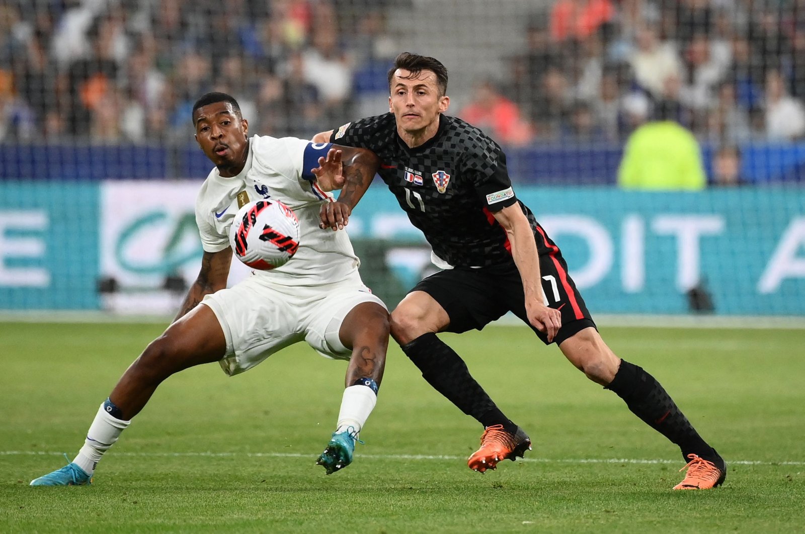 France defender Presnel Kimpembe (L) fights for the ball with Croatia forward Ante Budimir (R) in a UEFA Nations League match, Paris, France, June 13, 2022. (AFP Photo)