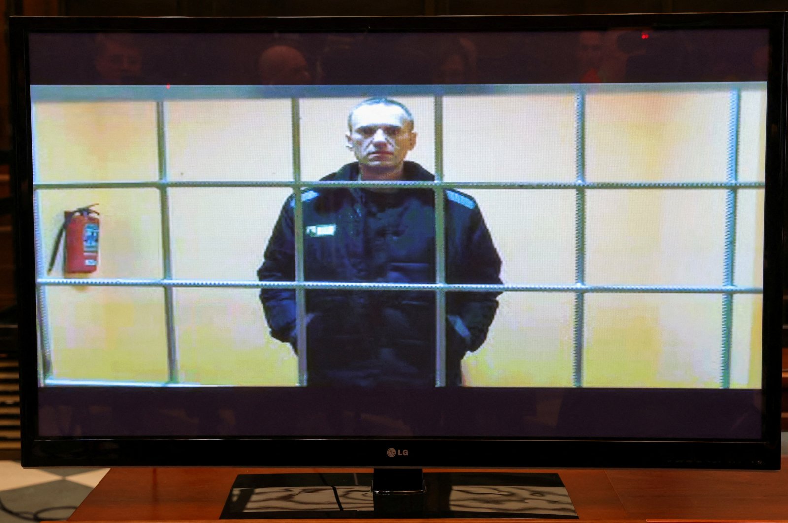 Russian opposition leader Alexei Navalny is seen on a screen via video link from the IK-2 corrective penal colony in Pokrov during a court hearing to consider an appeal against his prison sentence, Moscow, Russia, May 24, 2022. (Reuters Photo)