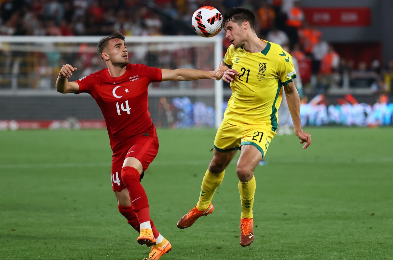 National team player Yunus Akgün (L) vies for the ball against Lithuania&#039;s Dominykas Barauskas during the UEFA Nations League match in Gürsel Aksel Stadium, Izmir, Turkey, June 14, 2022. (AA Photo)